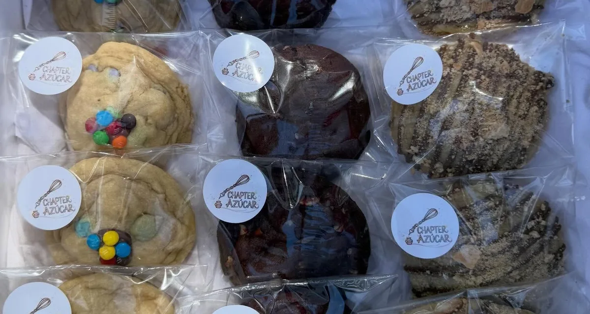 A dozen wrapped cookies packed in a box — M&M, dark chocolate, and s’mores-style flavors